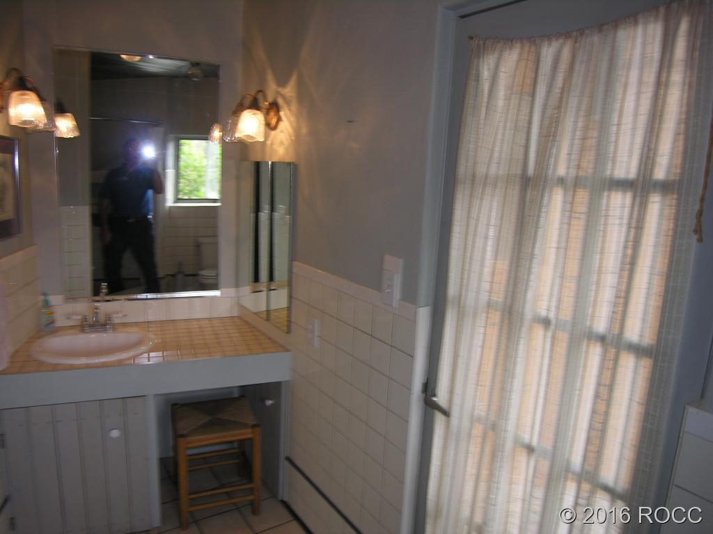 880 Burno Mountain Road Cotopaxi, CO 81223 - Photo 10 of 19 a bathroom with a sink and a mirror