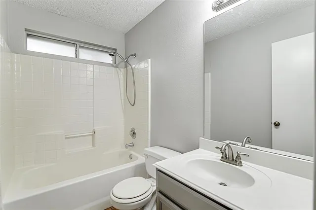 a view of a backyard with a table and chairs