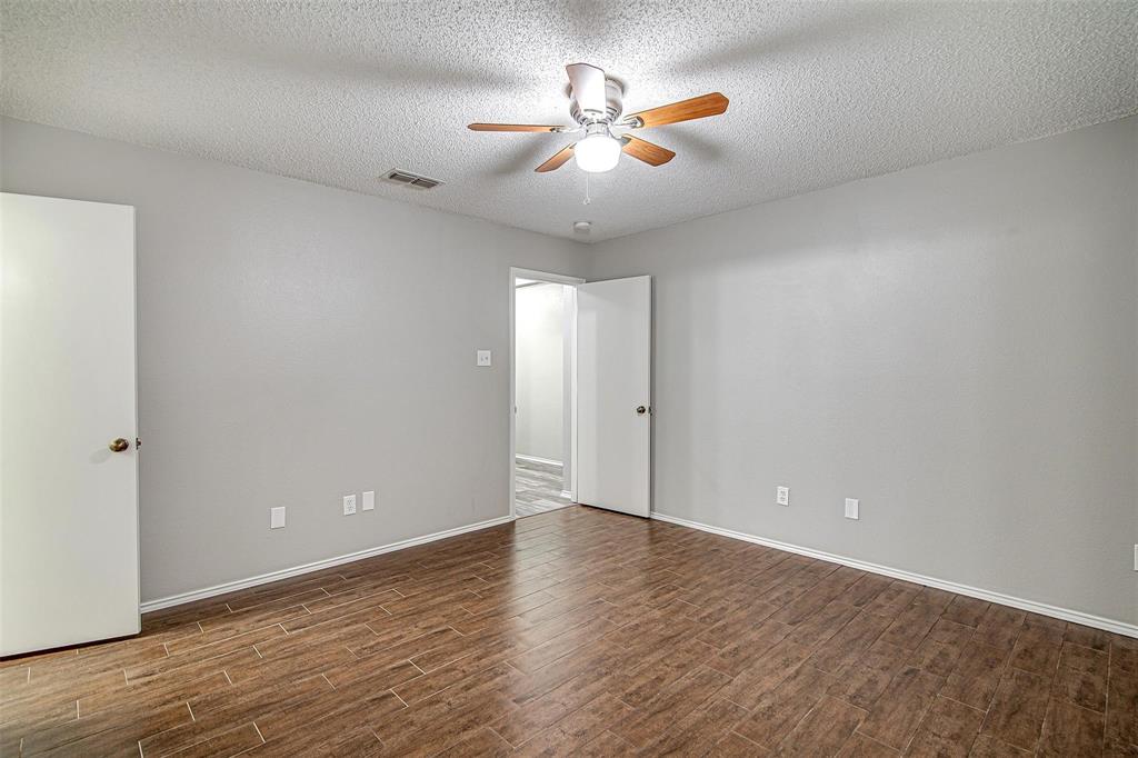 636 Green Mountain Road Burleson, TX 76028 - Photo 10 of 19 wooden floor in an empty room