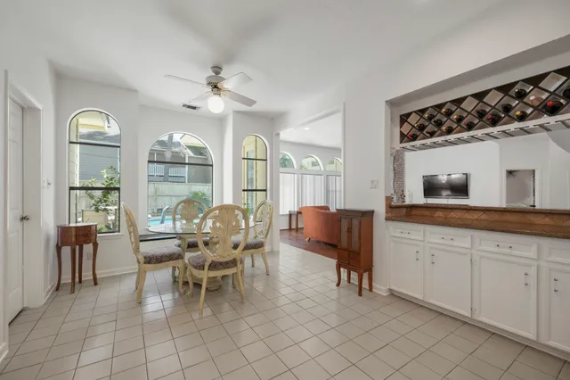 a dining room with furniture and window