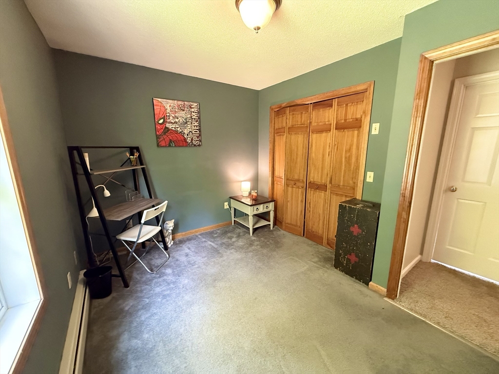 222 Bridge Street Warren, MA 01083 - Photo 23 of 40 a view of a workspace with furniture and a window