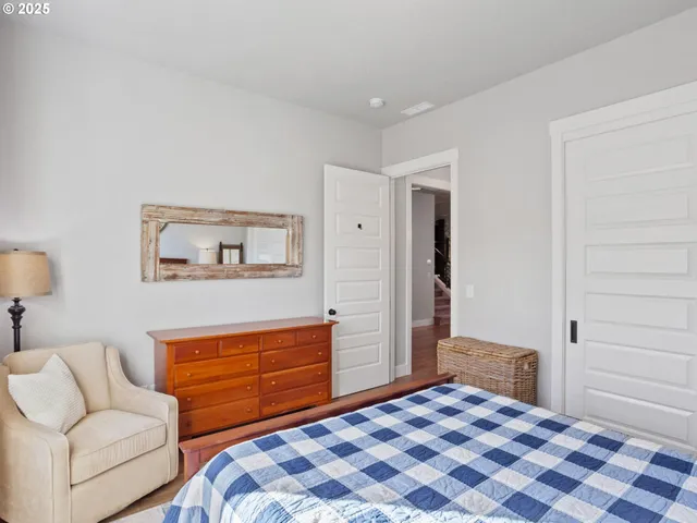 a bedroom with a bed and a couch