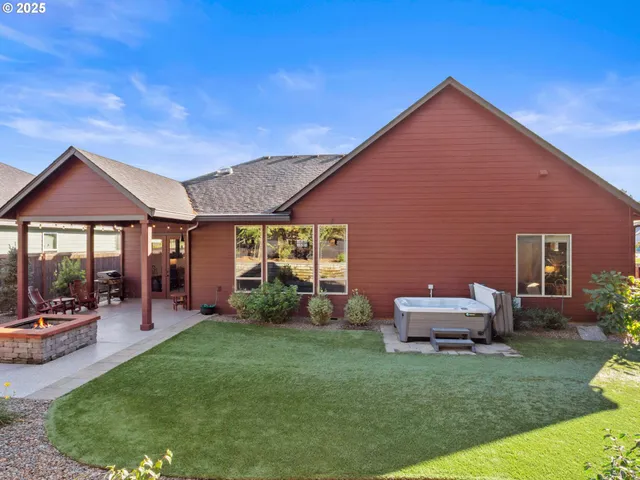 a front view of a house with swing and slide