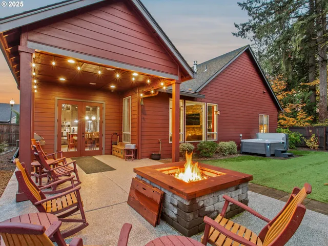 a backyard of a house with outdoor seating