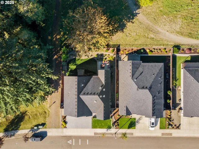 an aerial view of houses with outdoor space