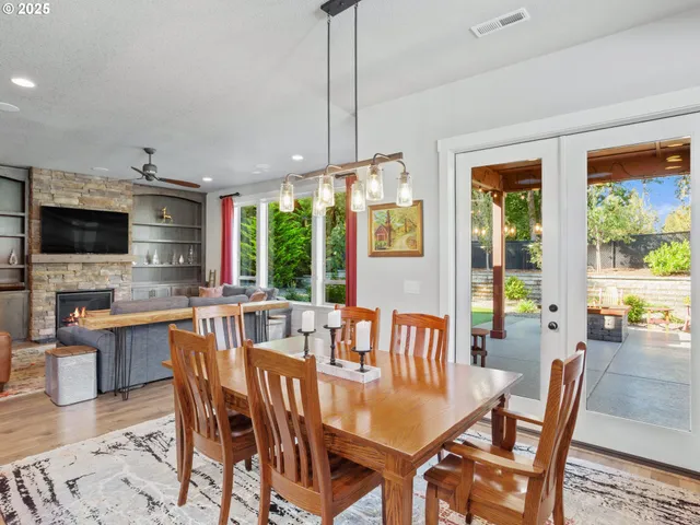a view of a dining room with furniture window and outside view