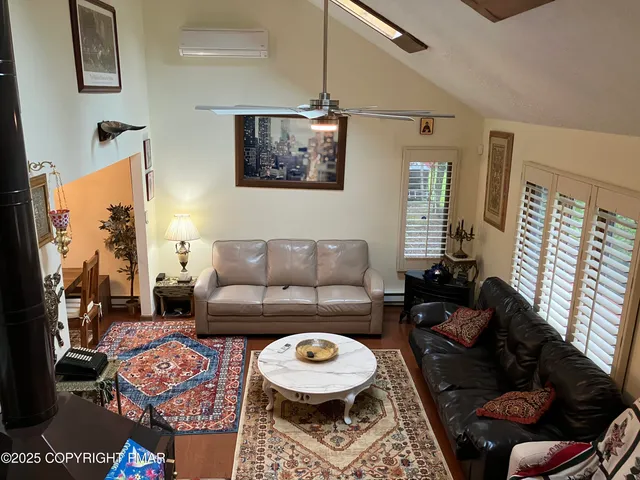 a view of a hallway with paintings on the wall