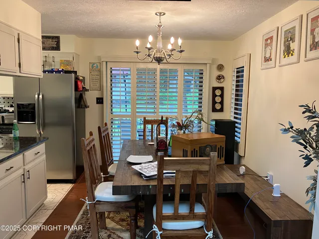 a bedroom with a bed and a television