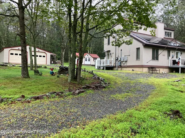 a view of a chairs and table on the deck