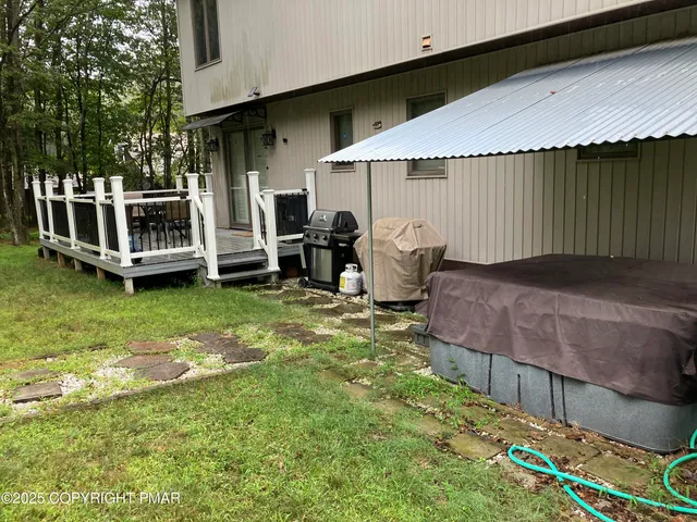 a dining room with furniture a chandelier and wooden floor