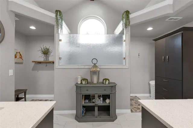 a kitchen with a sink a counter and cabinets