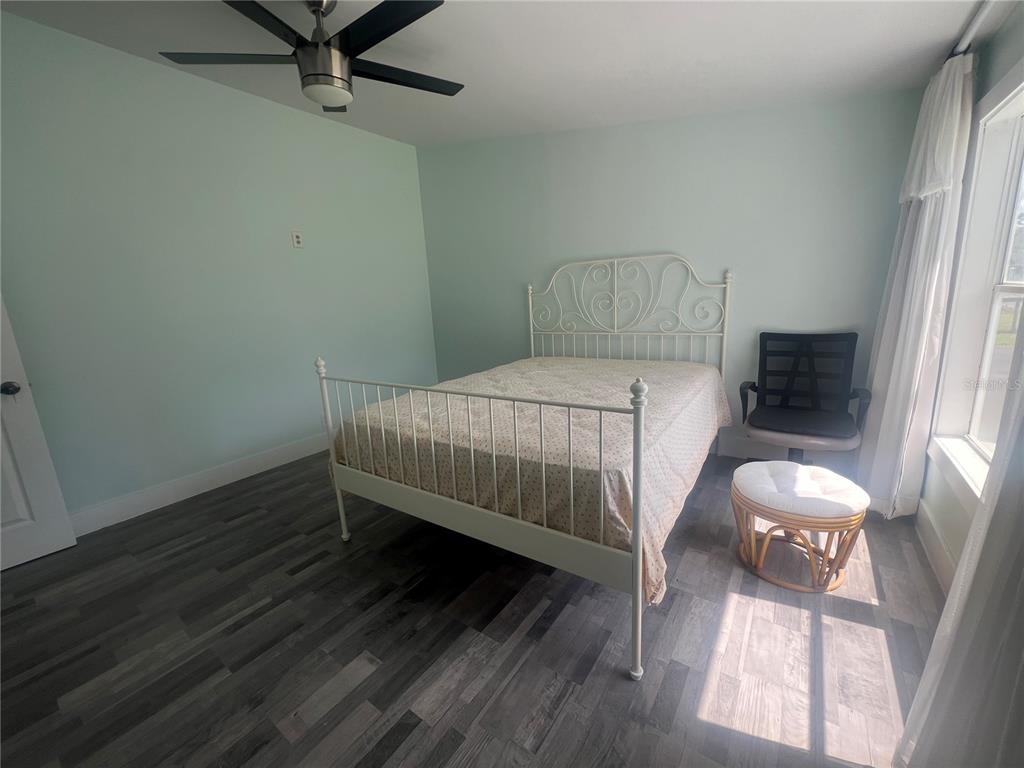 5855 Jack Brack Road St. Cloud, FL 34771 - Photo 71 of 86 a bedroom with a bed and a window
