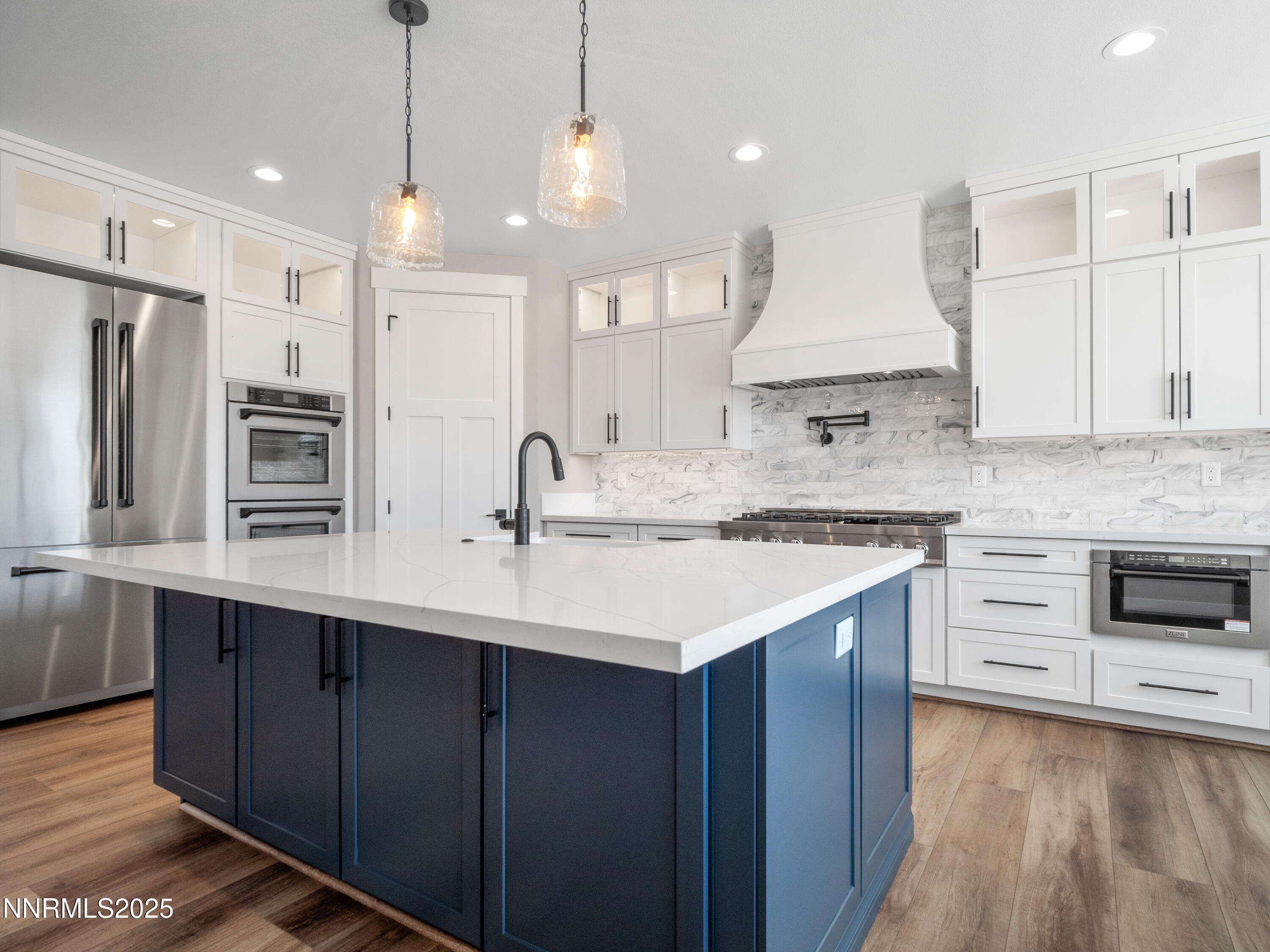 781 Rubio Way Gardnerville, NV 89460 - Photo 14 of 61 a kitchen with stainless steel appliances a sink stove oven and refrigerator