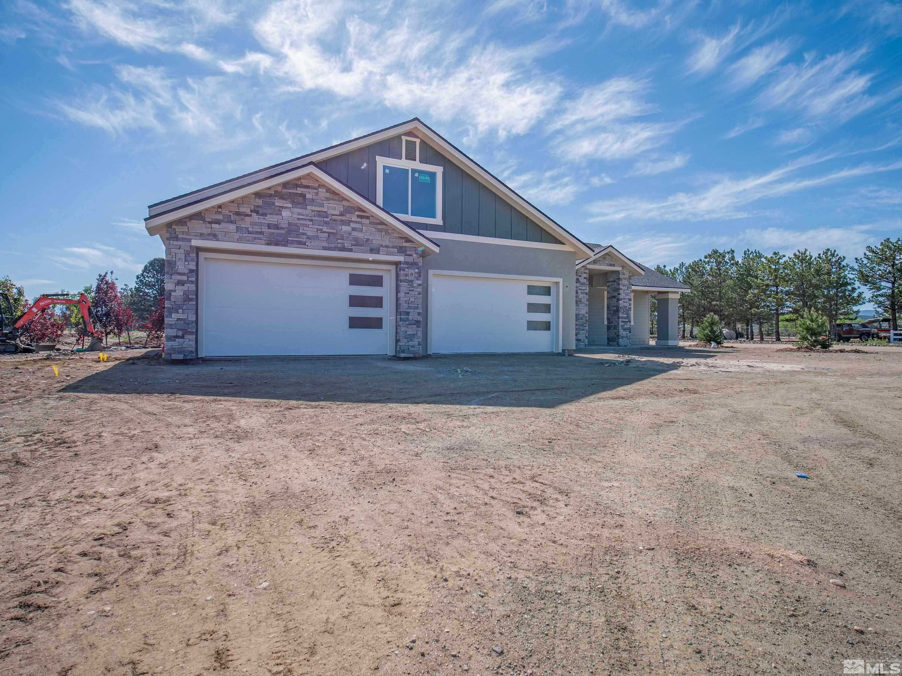 781 Rubio Way Gardnerville, NV 89460 - Photo 24 of 61 a front view of a house with a yard