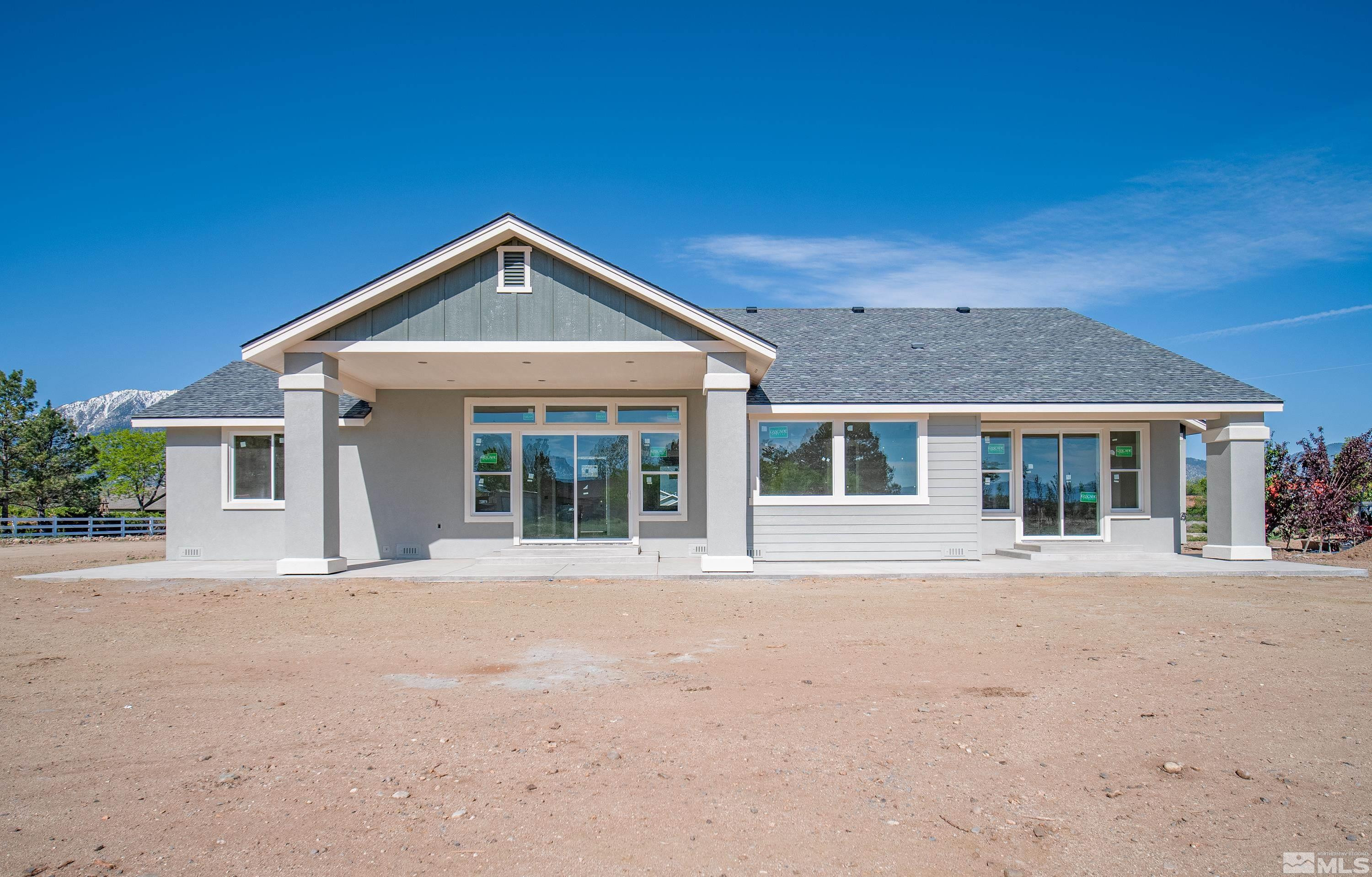 781 Rubio Way Gardnerville, NV 89460 - Photo 29 of 61 a front view of a house with a yard