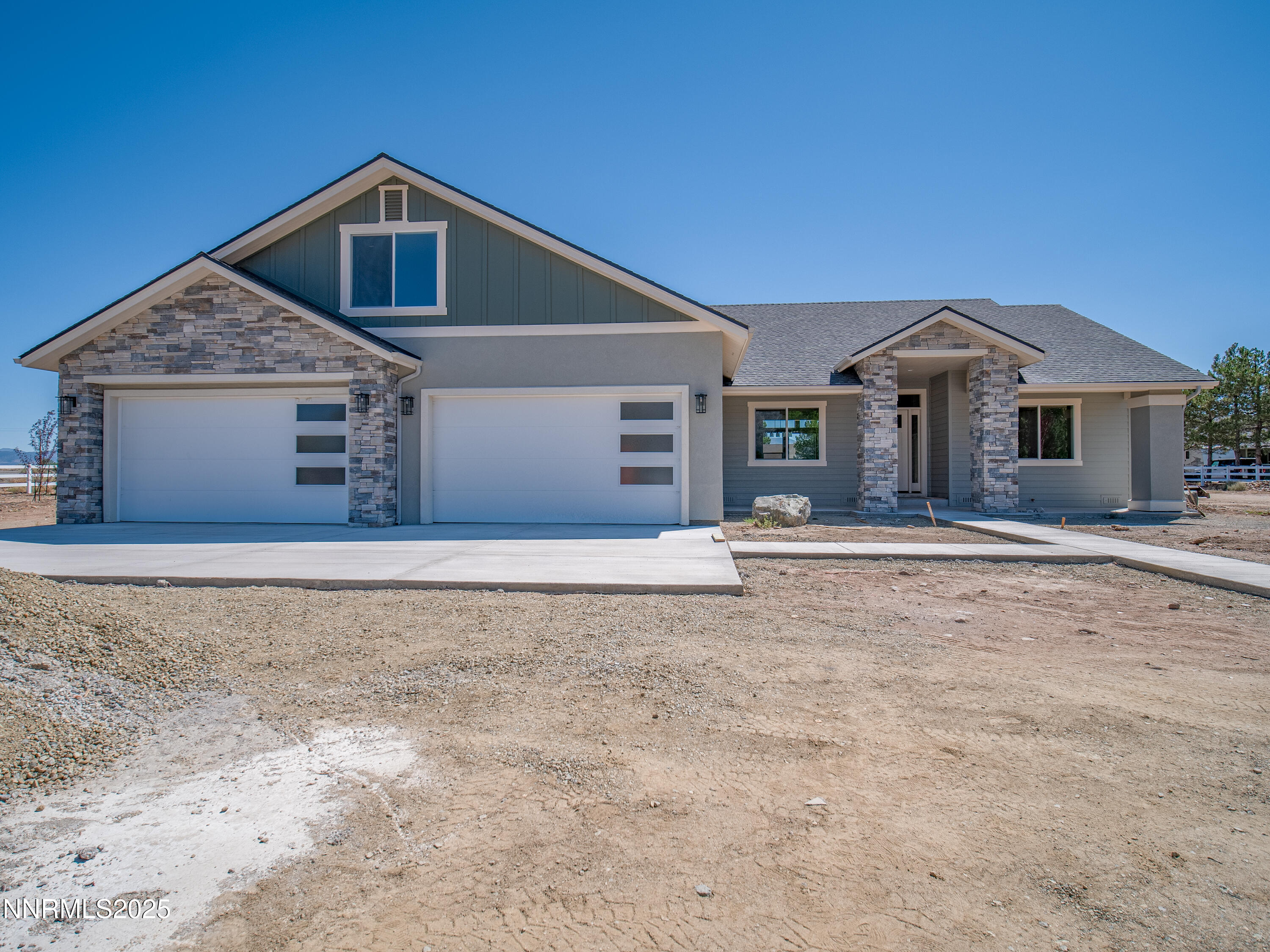 781 Rubio Way Gardnerville, NV 89460 - Photo 34 of 61 a front view of a house with a yard