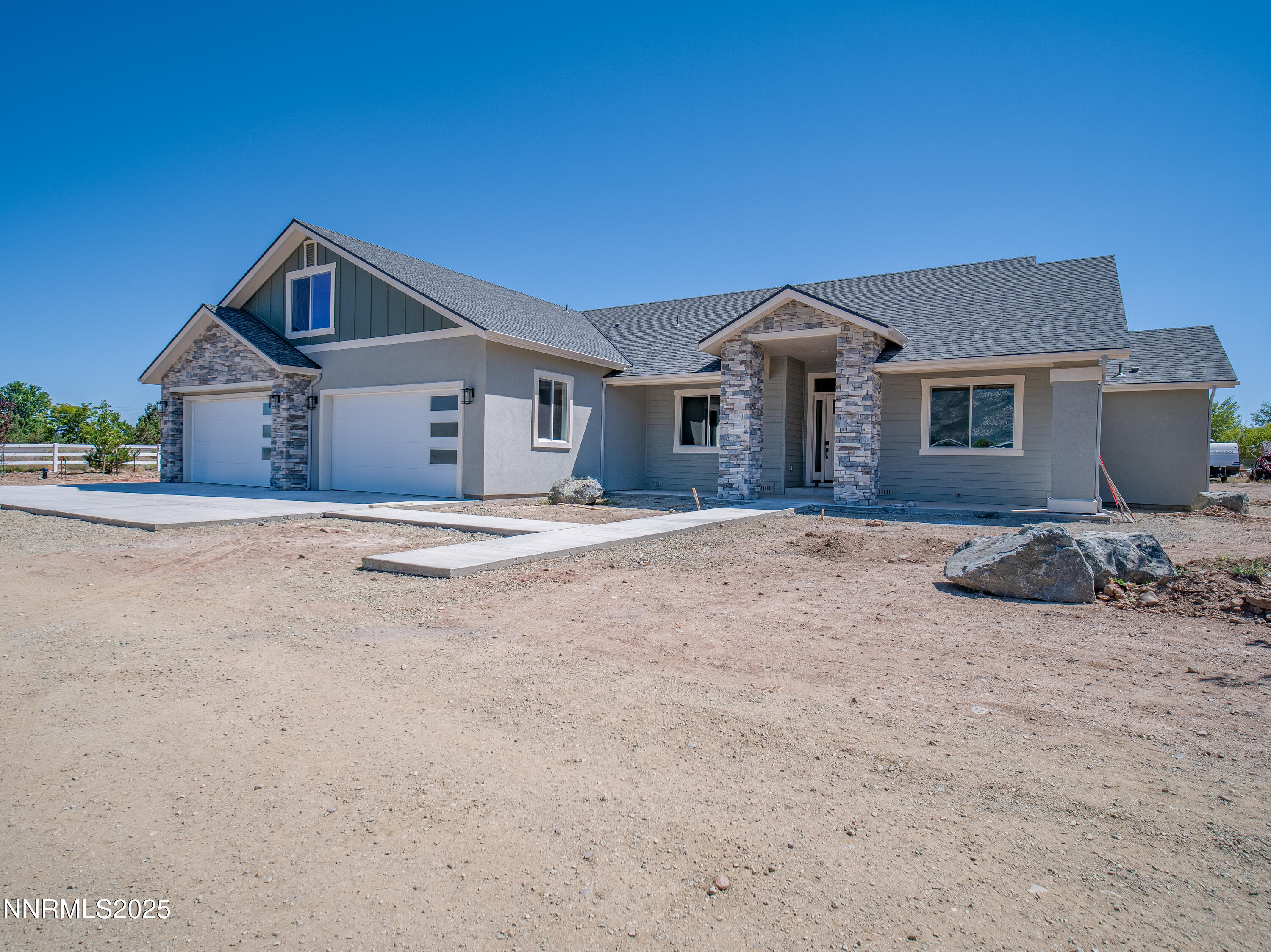 781 Rubio Way Gardnerville, NV 89460 - Photo 35 of 61 a front view of a house with a yard