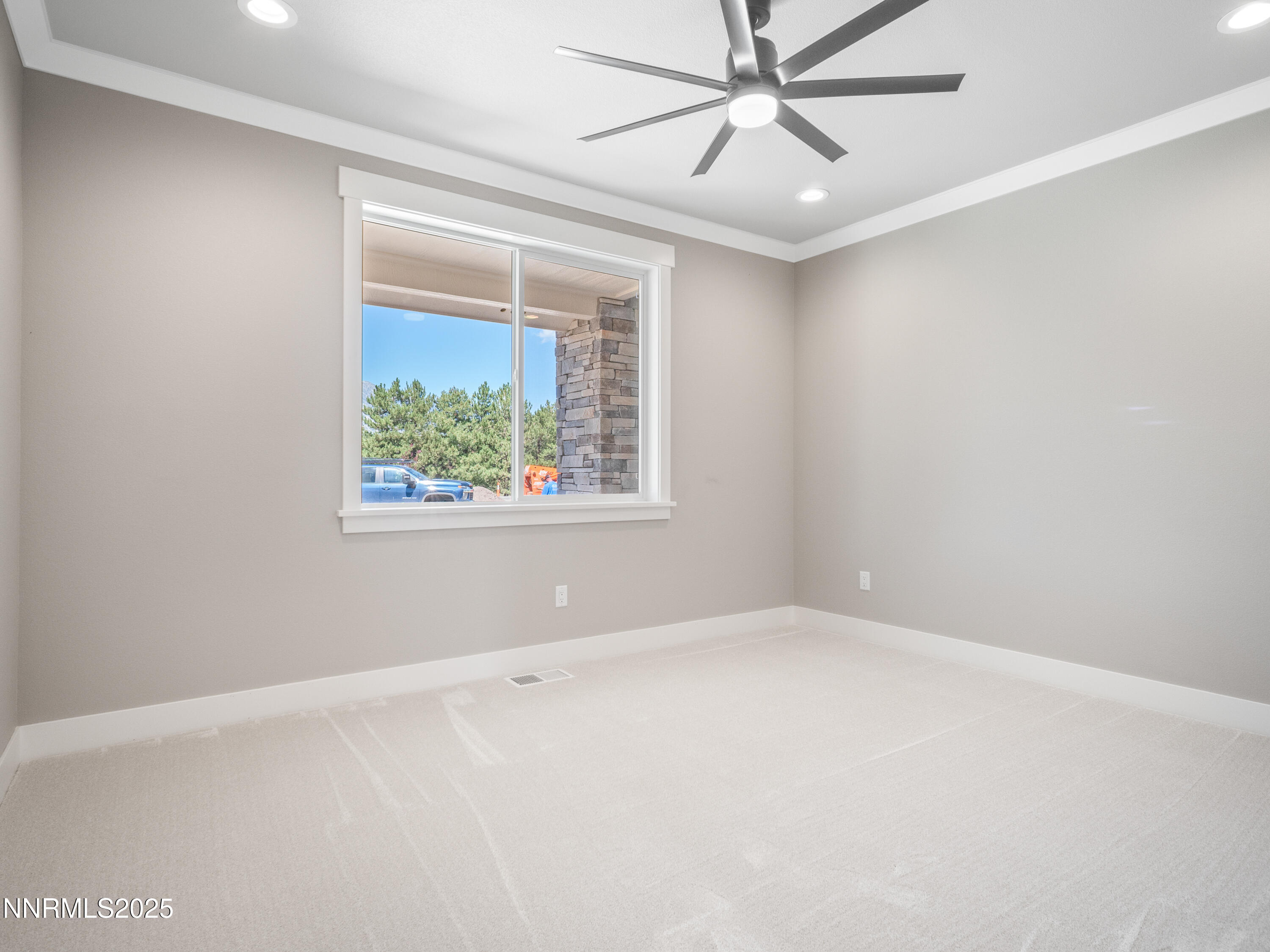 781 Rubio Way Gardnerville, NV 89460 - Photo 36 of 61 an empty room with a window and a fan