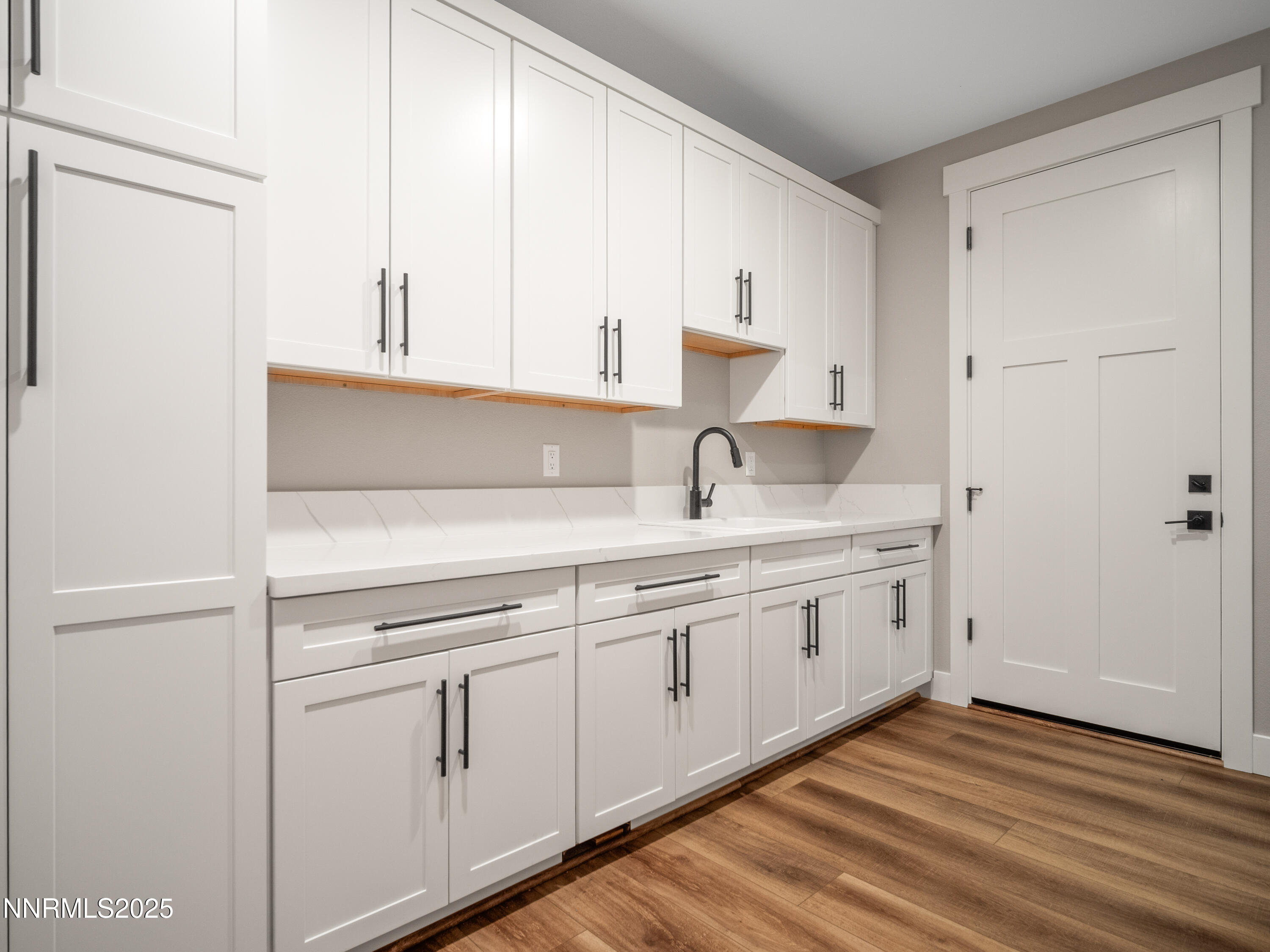 781 Rubio Way Gardnerville, NV 89460 - Photo 53 of 61 a kitchen with white cabinets and sink