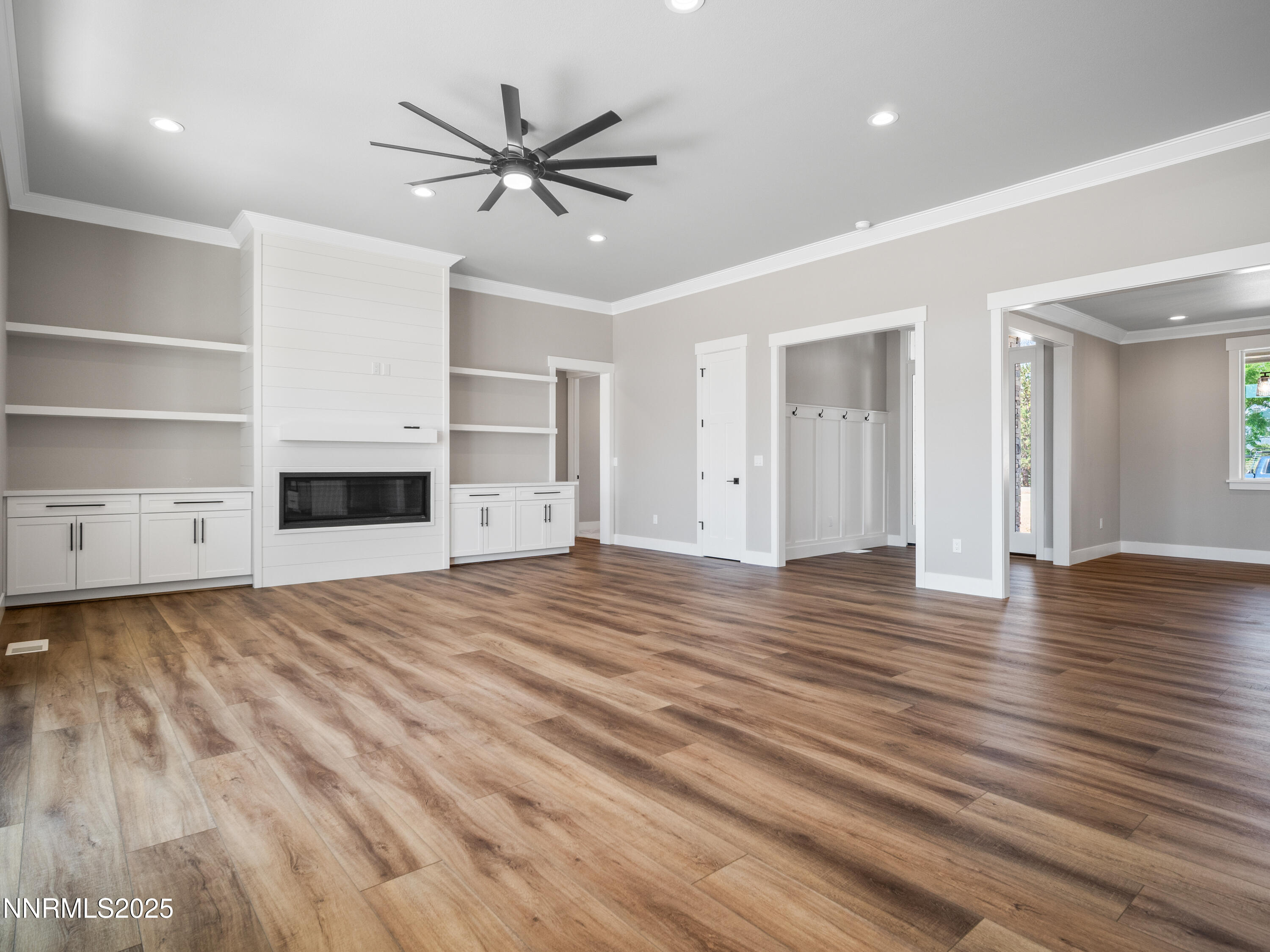 781 Rubio Way Gardnerville, NV 89460 - Photo 9 of 61 a view of a livingroom with a hardwood floor and a ceiling fan