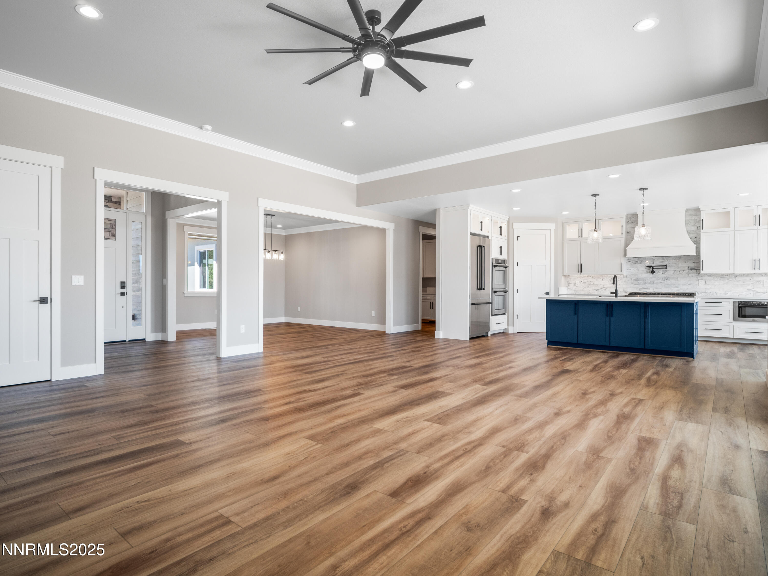 781 Rubio Way Gardnerville, NV 89460 - Photo 10 of 61 a view of empty room with wooden floor and ceiling fan