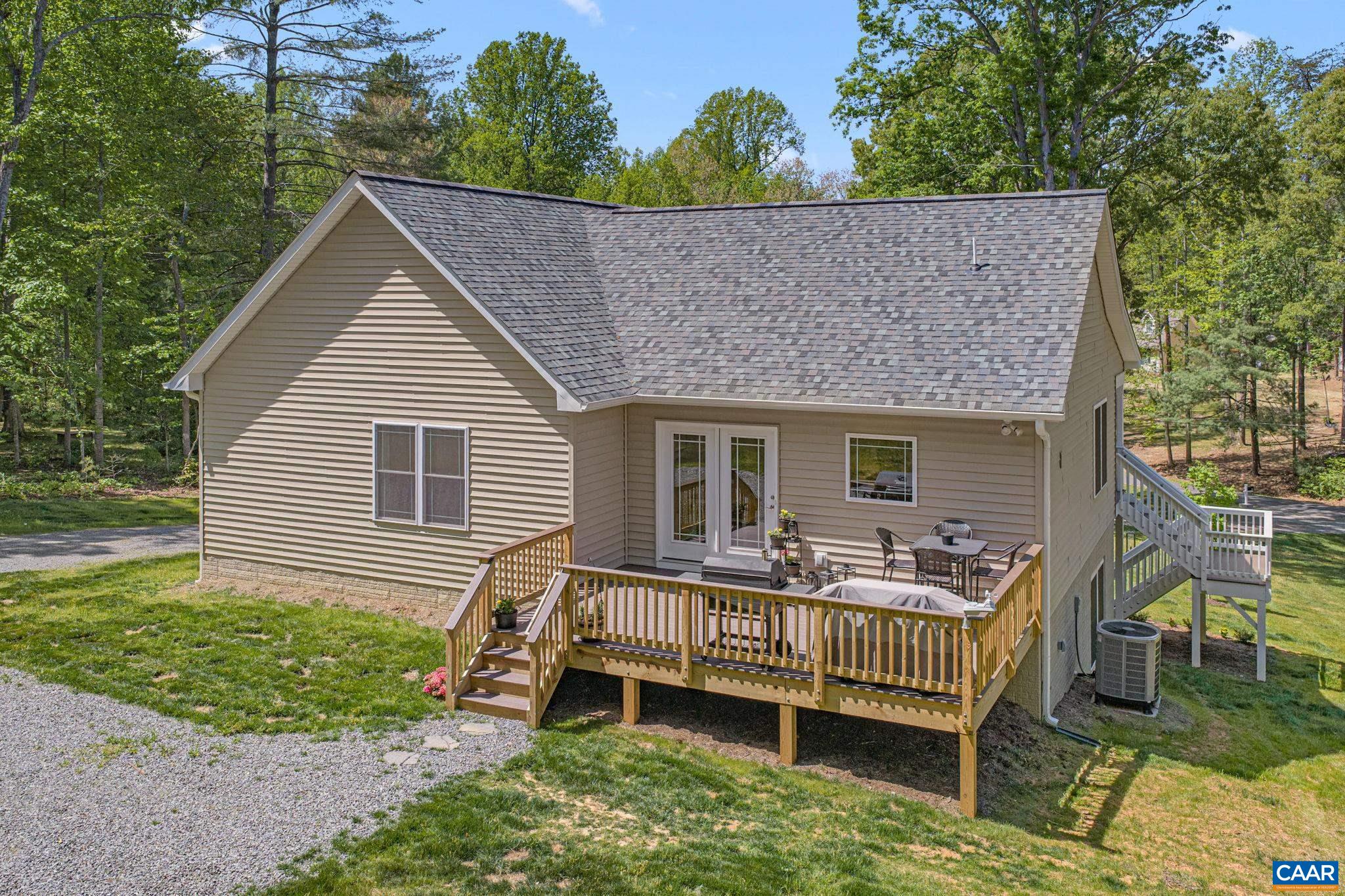 230 Fox Hollow Road Ruckersville, VA 22968 - Photo 6 of 42 a view of house with a deck and furniture