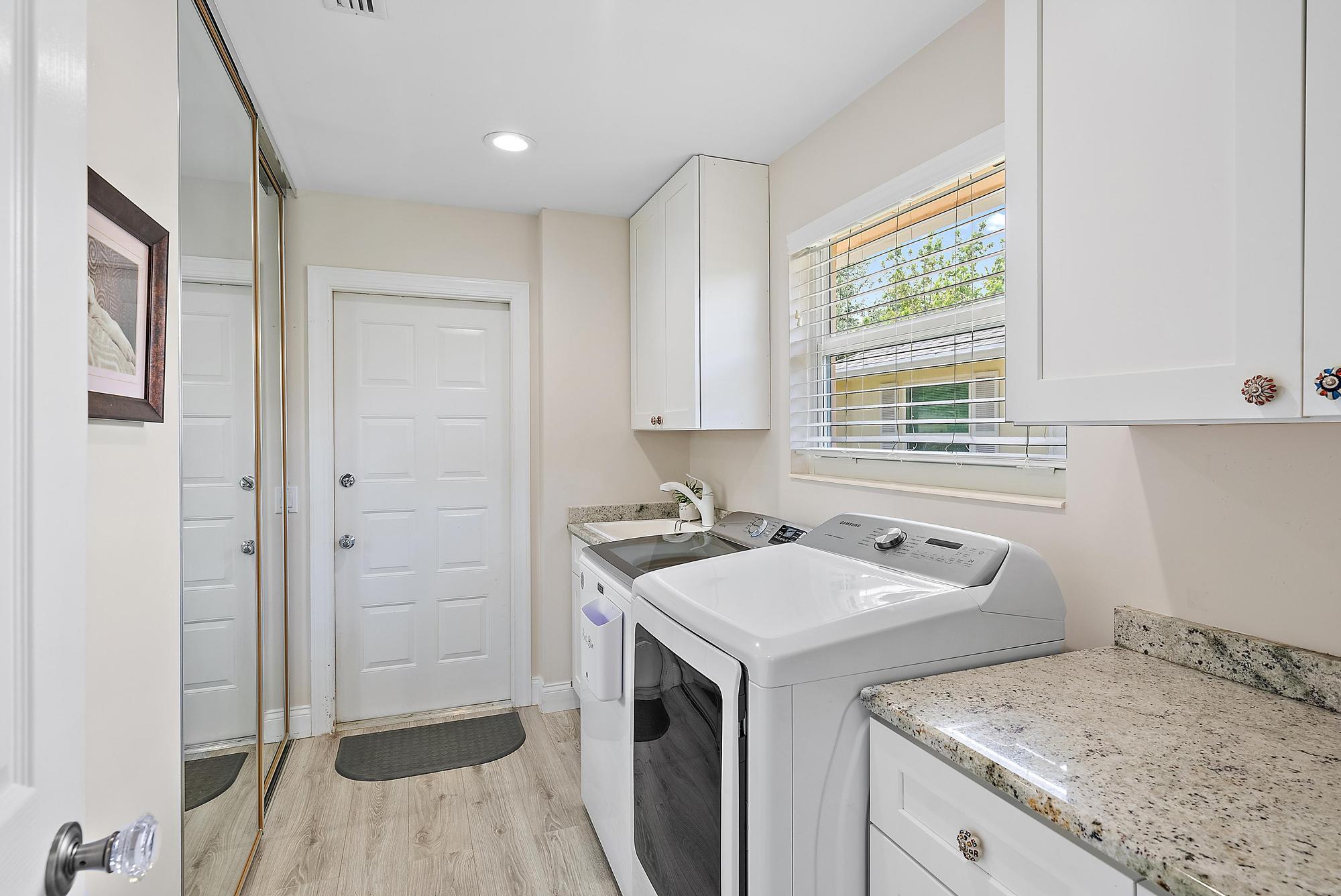 197 Brier Circle Jupiter, FL 33458 - Photo 19 of 33 a utility room with sink dryer and washer