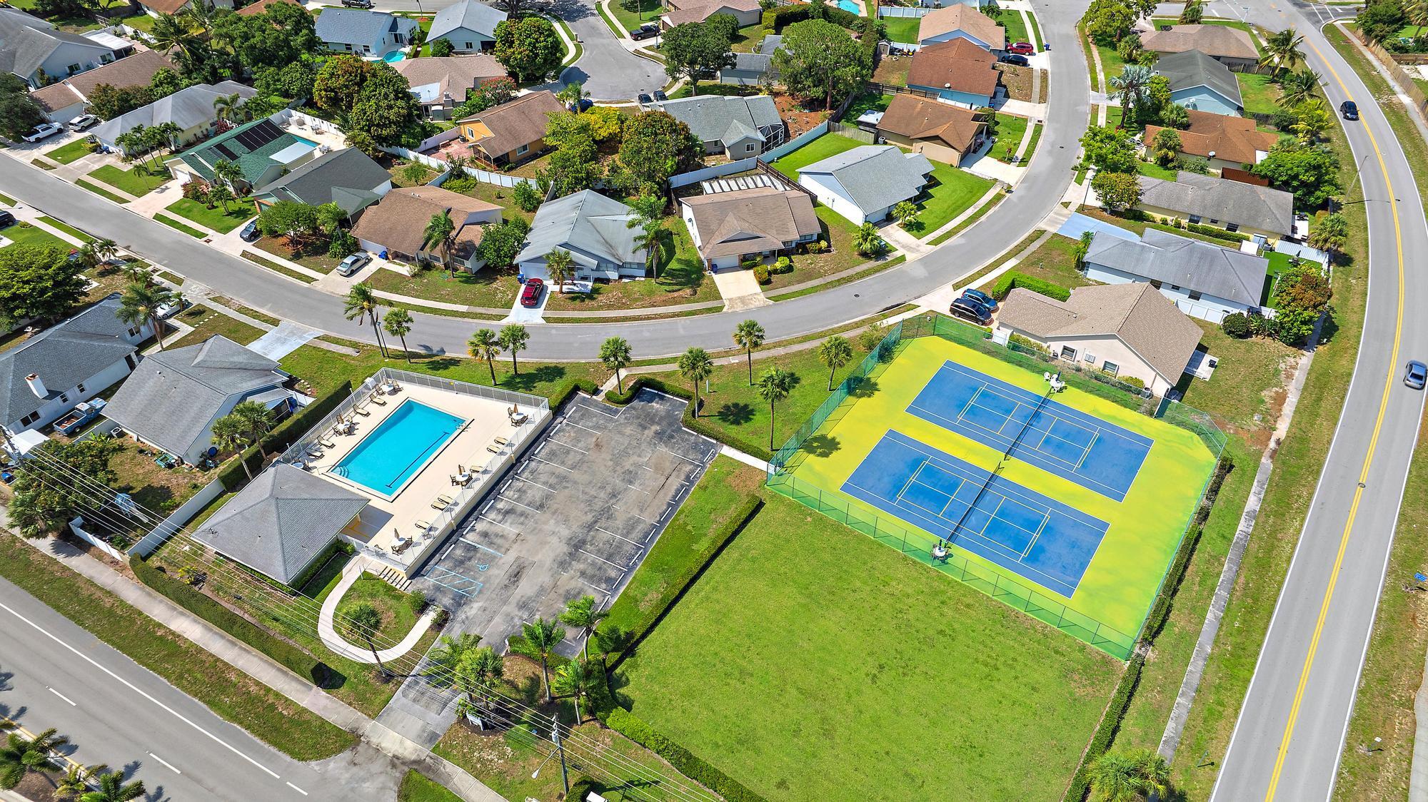197 Brier Circle Jupiter, FL 33458 - Photo 31 of 33 an aerial view of a pool patio swimming pool and outdoor seating