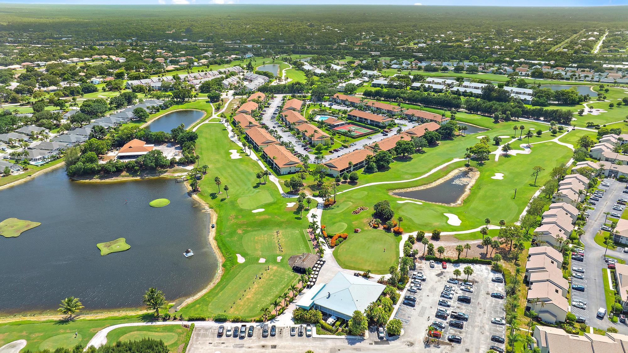197 Brier Circle Jupiter, FL 33458 - Photo 32 of 33 an aerial view of residential houses with outdoor space