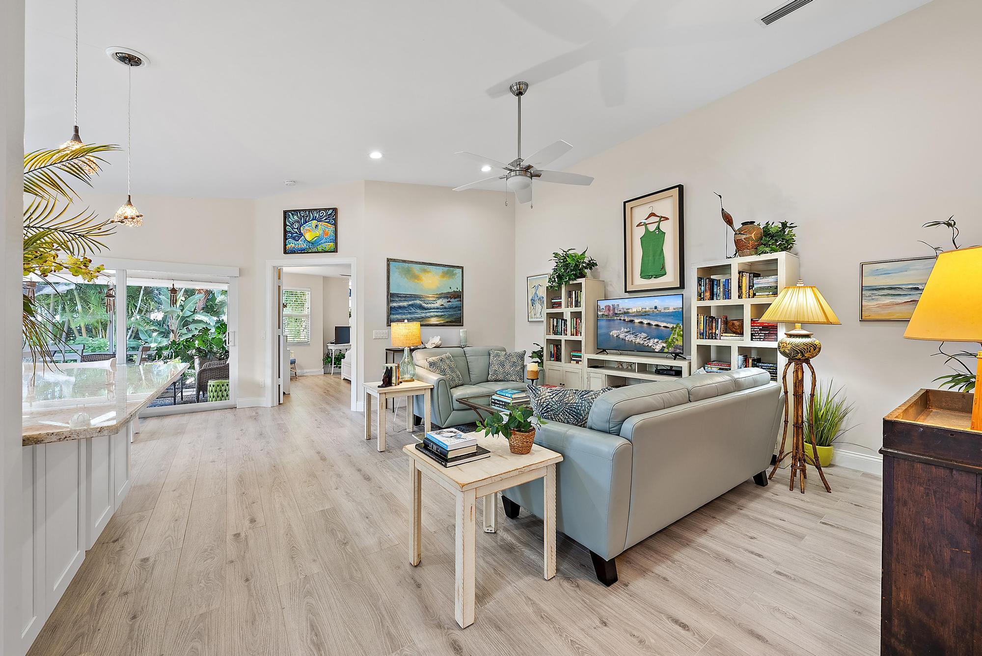 197 Brier Circle Jupiter, FL 33458 - Photo 9 of 33 a living room with furniture and a large window