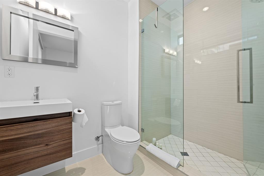 60 Hendricks Isle, Unit 301 Fort Lauderdale, FL 33301 - Photo 16 of 31 a bathroom with a toilet a sink and shower