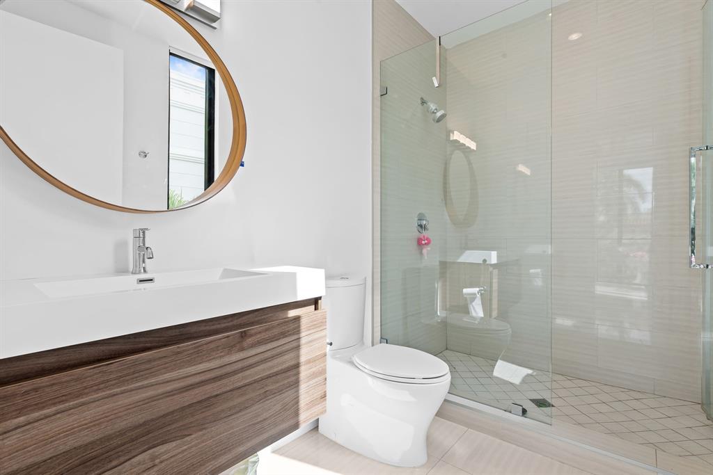 60 Hendricks Isle, Unit 301 Fort Lauderdale, FL 33301 - Photo 20 of 31 a bathroom with a sink a toilet and shower