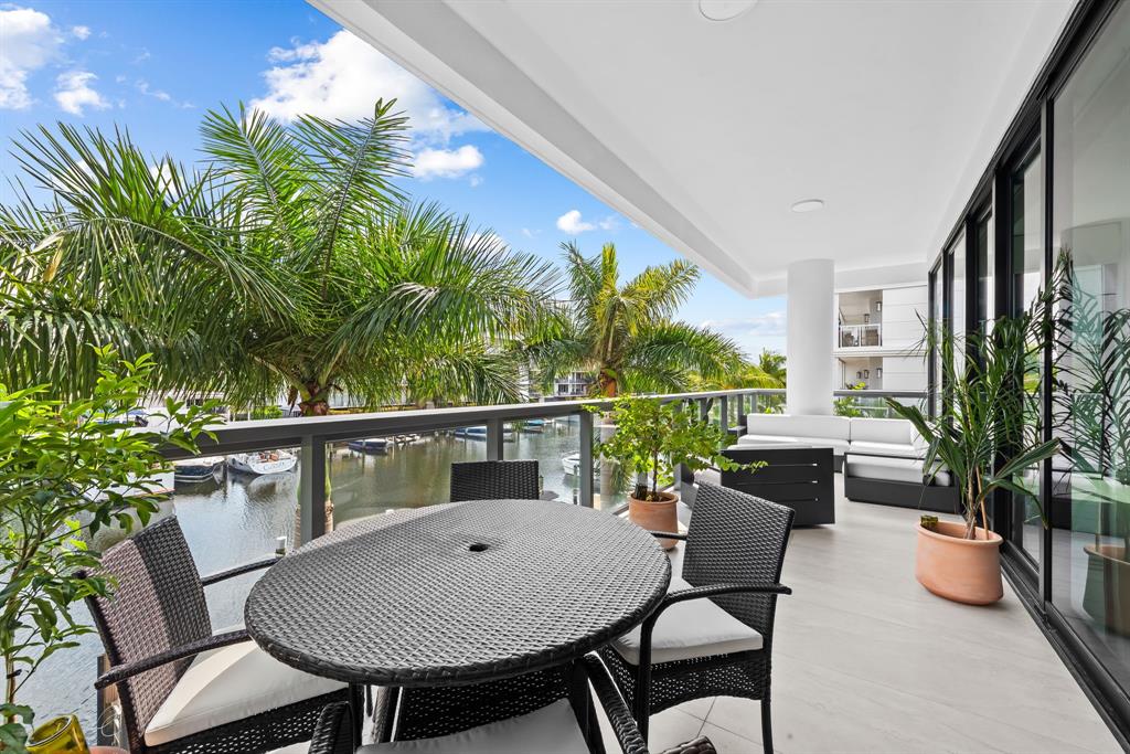 60 Hendricks Isle, Unit 301 Fort Lauderdale, FL 33301 - Photo 22 of 31 a view of a chairs and table in the balcony