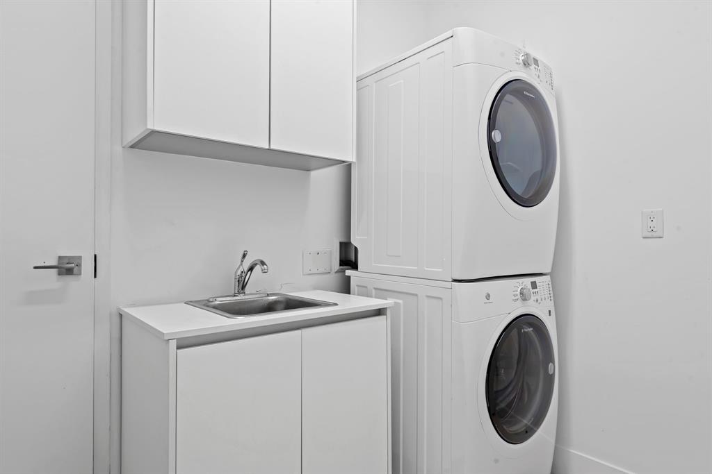 60 Hendricks Isle, Unit 301 Fort Lauderdale, FL 33301 - Photo 25 of 31 a utility room with sink dryer and washer