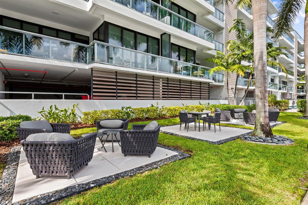 60 Hendricks Isle, Unit 301 Fort Lauderdale, FL 33301 - Photo 27 of 31 a view of a patio with couches chairs and potted plants