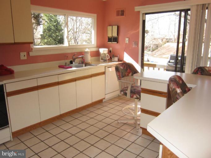 14905 Wellwood Road Silver Spring, MD 20905 - Photo 2 of 30 Sunny kitchen with sliders to deck