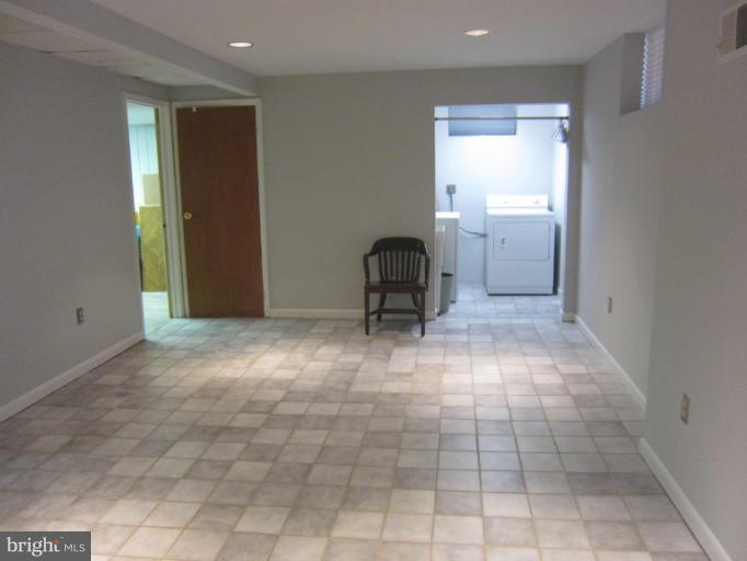 14905 Wellwood Road Silver Spring, MD 20905 - Photo 18 of 30 Finished lower level recreation room