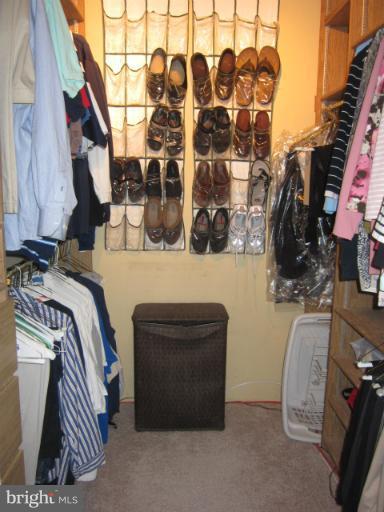 14905 Wellwood Road Silver Spring, MD 20905 - Photo 23 of 30 Master BR walk-in closet with shelving
