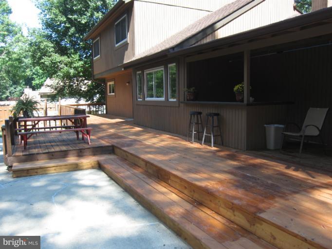 14905 Wellwood Road Silver Spring, MD 20905 - Photo 27 of 30 Wrap-around deck with new flooring, seating room