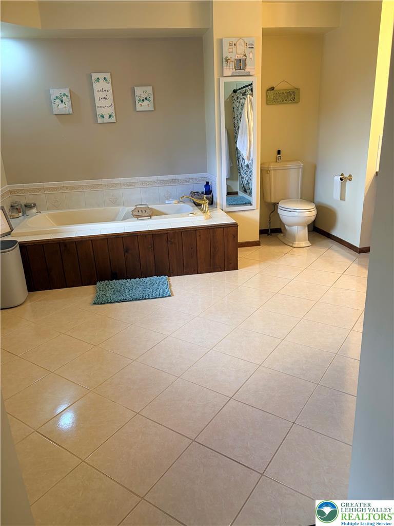 100 Hazelwood Road Lehighton, PA 18235 - Photo 25 of 31 a bathroom with a tub sink and a mirror