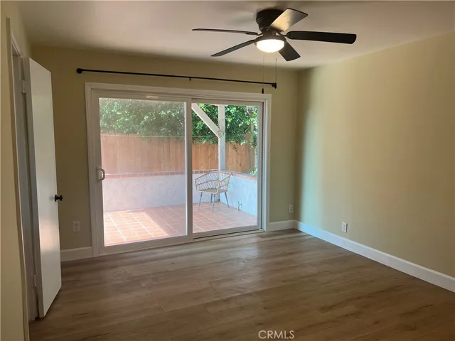 a bathroom with a granite countertop sink a toilet and shower