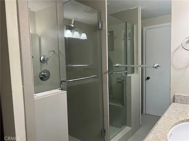 a view of two chairs in the balcony