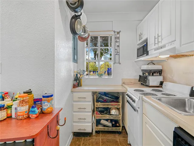 a view of kitchen and utility room
