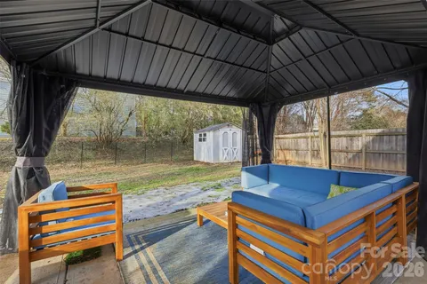 a room with pool table and windows