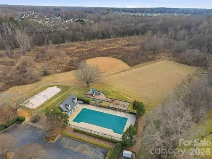 a kitchen with a stove a sink and cabinets