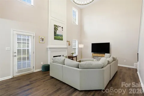 a living room with furniture and a ceiling fan