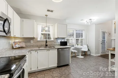 a view of swimming pool with a yard