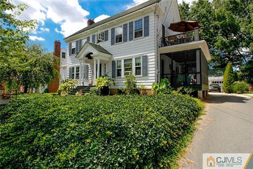 67 Pleasant Avenue Edison, NJ 08837 - Photo 2 of 25 a front view of a house with a yard