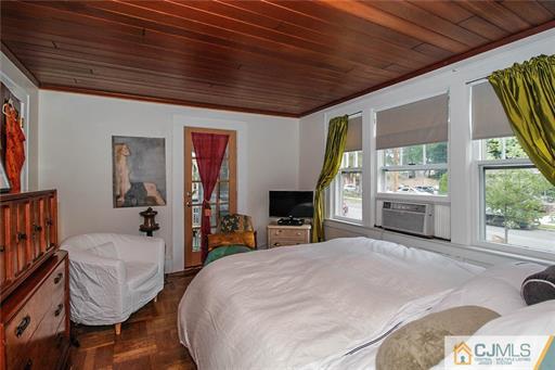 67 Pleasant Avenue Edison, NJ 08837 - Photo 13 of 25 a bedroom with a bed and wooden floor