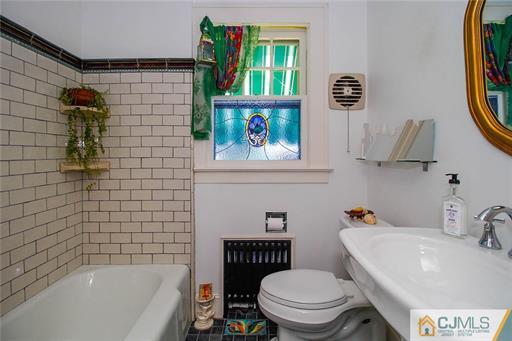 67 Pleasant Avenue Edison, NJ 08837 - Photo 14 of 25 a bathroom with a sink toilet and bathtub